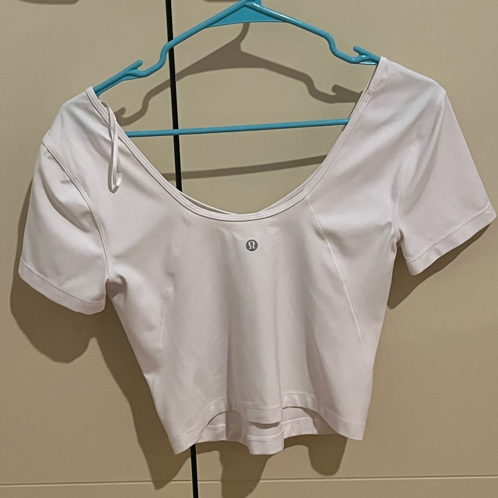 White lululemon crop top. Exercising material. Worn once. No flaws.